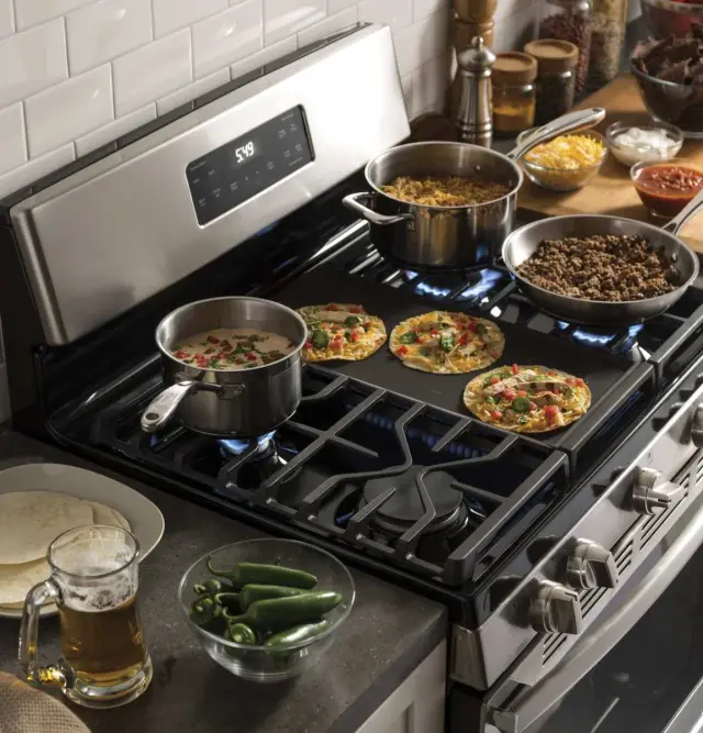 View of dinner being cooked on a GE gas range View of dinner being cooked on a GE gas range